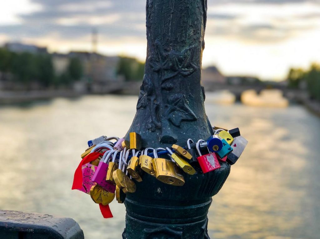 Love locks around a lamp post at the Pont des Arts Paris